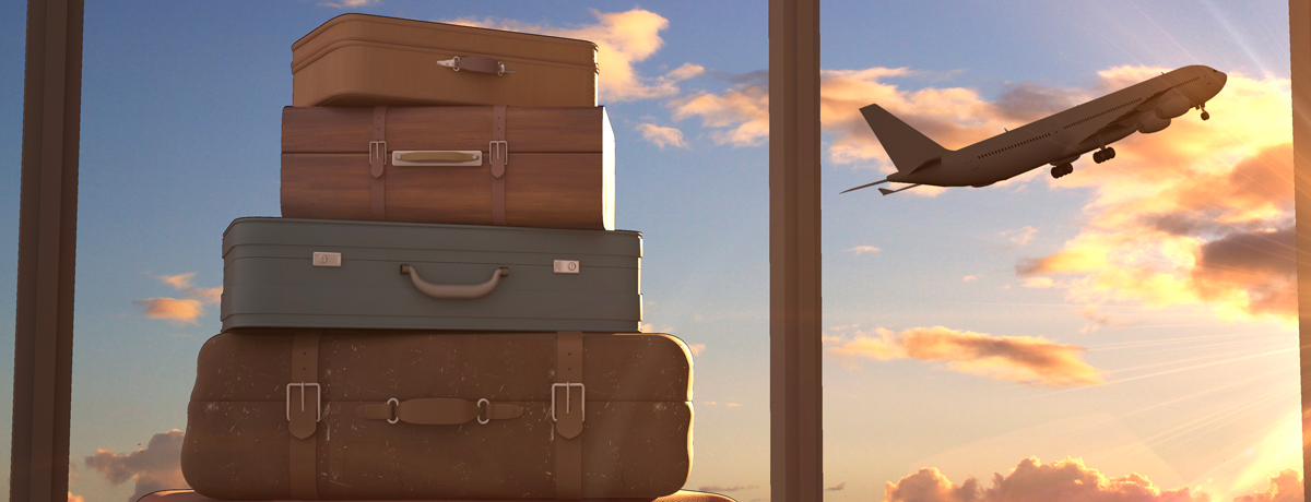 Colorful stacked suitcases in front of a window through which a plane is flying over clouds